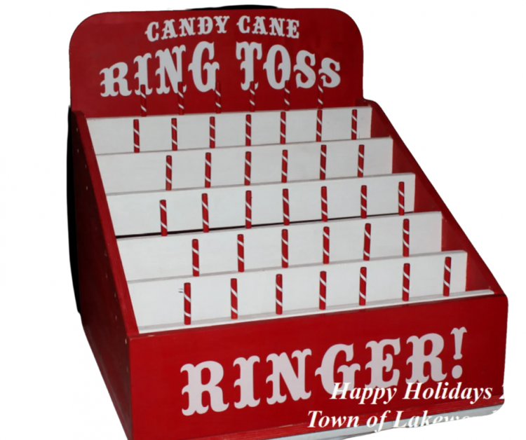 Ring toss carnival game holiday themed with candy cane color scheme for rent in Norton, OH. - Game Craze Party & Event Rentals